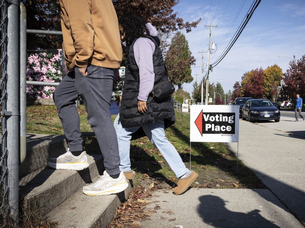 People vote at an advance polling station in Surrey on Oct. 21. People vote at an advance polling station in Surrey on Oct. 21.