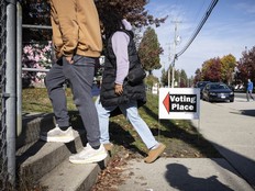 People at an advanced voting station in Surrey.