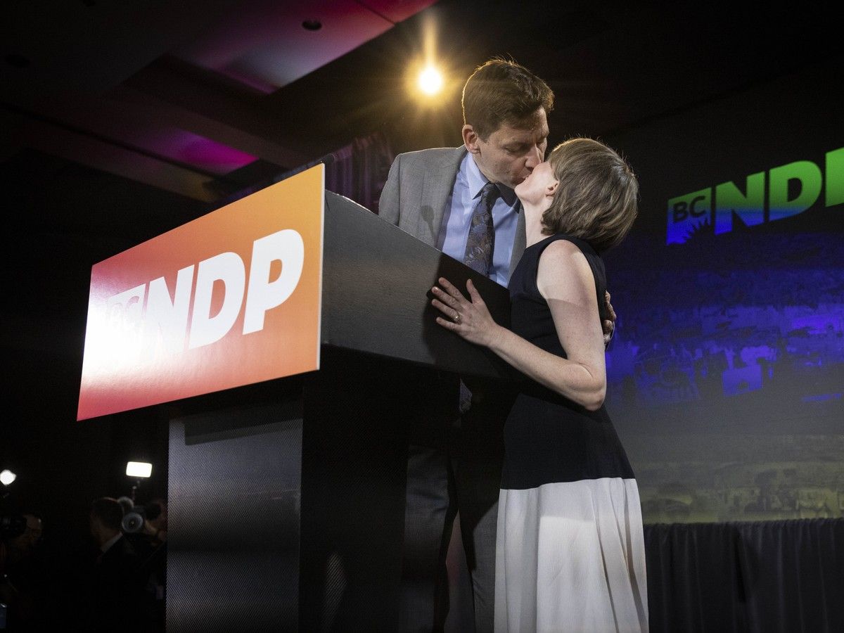 BC NDP leader David Eby kisses his wife Dr. Cailey Lynch, as he gives his concession speech after conceding defeat to the Conservative Party of BC, at the Marriott Pinnacle hotel in downtown Vancouver on Oct. 24, 2026.