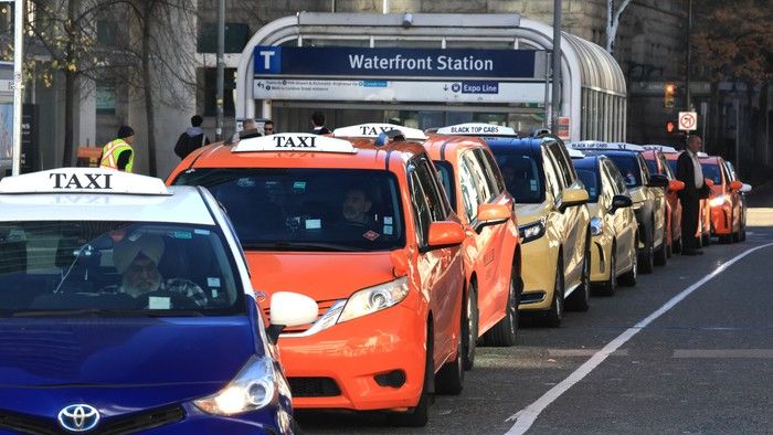 Taxis line up outside the Canada Place cruise ship terminal on Oct. 12, 2026.