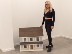 Corinne Lea with a piece by artist Jennifer Mae Wood