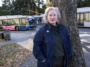 Poet Laureat of Vancouver Elee Kraljii Gardiner stands at the Dunbar bus loop.