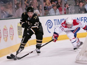 DALLAS - MARCH 8: Chris Conner #25 of the Dallas Stars tries to keep the puck away against Josh Gorges #26 of the Montreal Canadiens on March 8, 2009 at the American Airlines Center in Dallas, Texas.  (Photo by Glenn James/NHLI via Getty Images)