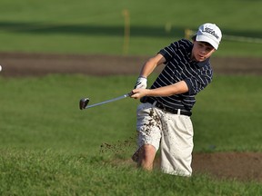 Jakob Cote hits out of the bunker while taking part in the Club 240 golf tournament at Roseland Golf and Curling Club in Windsor on Wednesday, Aug. 24, 2011.              (TYLER BROWNBRIDGE / The Windsor Star)