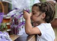 HARROW, ONT .: JULY 24, 2010 -Stella, 6, smells some salts made by Serenity Lavender during the Explore the Shore event in which various companies booths are set up along the Lake Erie shore on County Road 50.  (BEN NELMS/The Windsor Star)