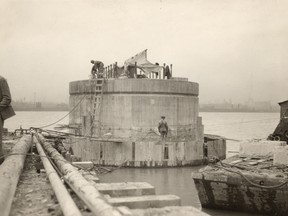 Workers work on the base of the Ambassador Bridge. No other file info.(Windsor Star-FILE) HISTORIC