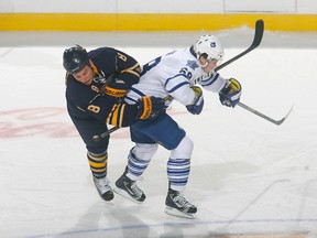 Cody McCormick #8 of the Buffalo Sabres collides with Kenny Ryan #68 of the Toronto Maple Leafs at First Niagara Center on September 24, 2011 in Buffalo, New York.  (Photo by Rick Stewart/Getty Images)