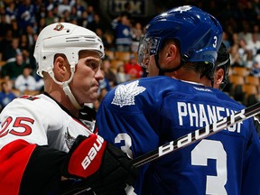 Dion Phaneuf #3 of the Toronto Maple Leafs roughs up Chris Neil #25of the Ottawa Senators during preseason NHL action at the Air Canada Centre September 19, 2011 in Toronto, Ontario, Canada. (Abel Images/Getty Images)