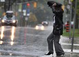 A pedestrian crosses Sunset Ave. in Windsor, Ont  during a rainy day Monday Sept. 26, 2011. (DAN JANISSE/THE WINDSOR STAR)