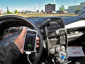 A driver texts in this file photo. (Larry Wong/Edmonton Journal)