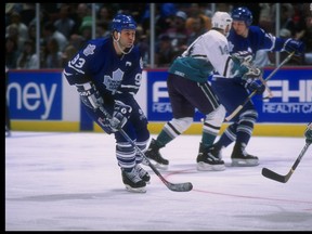 In this March 17, 1995 file photo, centre Doug Gilmour, left, of the Toronto Maple Leafs, moves down the ice during a game against the Anaheim Mighty Ducks at Arrowhead Pond in Anaheim, Calif.  The game was a tie, 4-4. (Glenn Cratty  /Allsport)