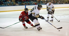 LaSalle Vipers forward Dylan Denomme protects the puck from Leamington Flyers forward Austin Mattson Oct. 12 at the Vollmer Centre. (Photo By: Joel Boyce)