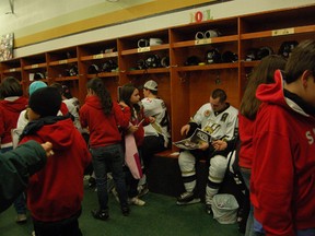 LaSalle Vipers forward Eric Noel signs autographs for Columbian kids attending Académie Ste. Cécile Wednesday night at the Vollmer Centre. (Photo By: Irma Tremblay)