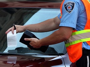 A parking ticket is handed out in this file photo. (Windsor Star files)
