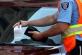 A parking ticket is handed out in this file photo. (Windsor Star files)