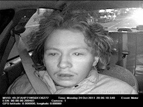 Police have released surveillance photos of a suspect wanted in connection the knife-point robbery of a taxi driver near Cameron Avenue and Wyandotte Street on Monday, Oct. 24, 2011.