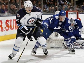 Leafs forward Tyler Bozak, right, defends Winnipeg's Blake Wheeler Wednesday night. (Abelimages, Getty Images)