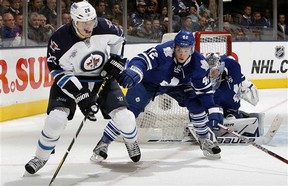Leafs forward Tyler Bozak, right, defends Winnipeg's Blake Wheeler Wednesday night. (Abelimages, Getty Images)