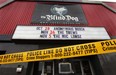 Police tape surrounds the front of The Blind Dog bar on Ouellette Avenue on Wednesday, Nov. 9, 2011, in Windsor, Ont. A fire was reported inside the club around 1 a.m.