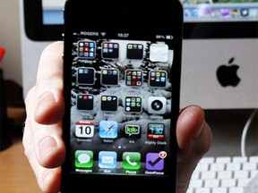 An iPhone 4 in this 2011 file photo. Photo by Leah Hennel / Calgary Herald