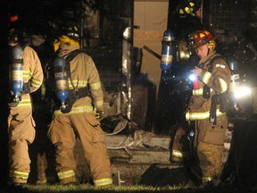 Windsor Fire and Rescue Services tend to a house fire on the 800 block of Assumption Street. (Photo By: Dax Melmer)