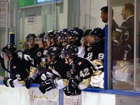 The LaSalle Vipers watch the action on the ice as associate coaches (left to right) Greg Prymack and Jimi St. John, and general manager Kevin McIntosh coach the team against the Leamington Flyers Dec. 14 at the Vollmer Centre. (Photo By: Irma Tremblay)