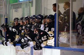 The LaSalle Vipers watch the action on the ice as associate coaches (left to right) Greg Prymack and Jimi St. John, and general manager Kevin McIntosh coach the team against the Leamington Flyers Dec. 14 at the Vollmer Centre. (Photo By: Irma Tremblay)