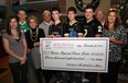 Representatives from the WECSSAA Football for the Cure fundraising campaign presented a cheque Wednesday, Dec. 21, 2011, for $11,800 to the Windsor Regional Cancer Centre.