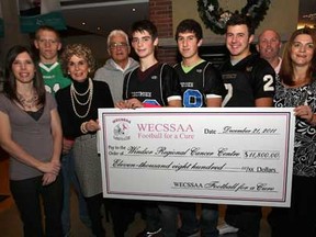Representatives from the WECSSAA Football for the Cure fundraising campaign presented a cheque Wednesday, Dec. 21, 2011, for $11,800 to the Windsor Regional Cancer Centre.