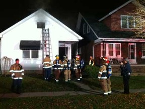 Windsor firefighters on the scene of a house fire in the 1300 block of Langlois Avenue in Windsor on Dec. 2, 2011. (Photo By: Nick Brancaccio)