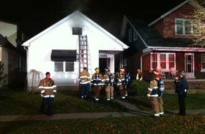 Windsor firefighters on the scene of a house fire in the 1300 block of Langlois Avenue in Windsor on Dec. 2, 2011. (Photo By: Nick Brancaccio)