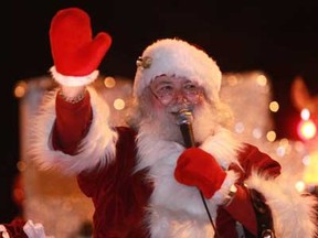 Santa Claus waves to the crowd in the 2011 parade. (Photo By: Dax Melmer)
