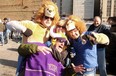 Big Cheese hams it up with Lions' and Vikings' fans at a tailgating party before the game Sunday.