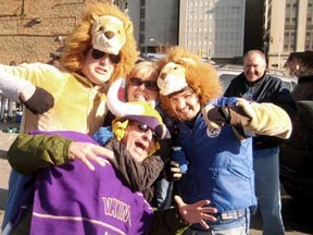 Big Cheese hams it up with Lions' and Vikings' fans at a tailgating party before the game Sunday.