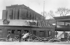 Feb.23/1944-Work is underway to remove the old Walkerville Ferry building which occupy the site of the proposed new grain elevator to be erected by the Hiram Walker and Sons Grain Corporation Limited, on the riverfront. Workers are shown salvaging the substantial buildings, all of which will be removed to make way for the big elevator which will house more than a million and a quarter bushels of grain at one time. (The Windsor Star-FILE)