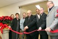 Mel Pace, chair of the Leamington District Memorial Hospital dialysis camapaign committee cuts the ribbon at the unveiling of the hospital’s new satellite dialysis unit on Friday, Dec. 16, 2011. (From left to right) Patricia Dwyer, Erie St. Clair Regional Director Ontario Renal Network, MPP Teresa Piruzza (Windsor-West), Dr. Wayne Callaghan, Windsor Regional nephrologist, Mel Pace, dialysis campaign chair, Gary Switzer, CEO of Erie St. Clair LHIN, John Stenger, LDMH CEO and Bryan Meyer, chair of the LDMH Board of Directors.