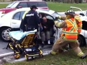 At least one motorist was treated by paramedics for injuries following a collision between two vehicles in the 10100 block of Riverside Drive East. (Photo By: Nick Brancaccio)