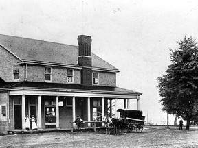 1902-Page Bros. General Store/Post Office situated on the Eliot side road and Front rd. in Ojibway on the way to Amherstburg, The Detroit River is in the background. (The Windsor Star-FILE)
