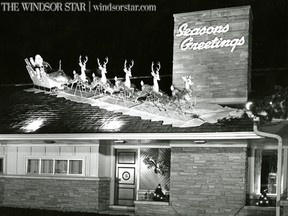 Dec.21/1954-The home of Mr. Ernest W.J.  Waddell at 2228 Riverside Dr. The bright lighting and appealing figures of Santa Claus and his reindeer on the roof have scores of motorists stopping outside to admire the view. (The Windsor Star-Mike Bunt)