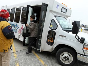 Passengers exit and enter the Tecumseh bus at the Tecumseh Mall in Windsor on Wednesday, January 25, 2012. The bus service has tripled it riders since it began stopping at the mall. (TYLER BROWNBRIDGE / The Windsor Star)