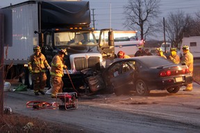 Tecumseh firefighters mop up after a head-on collision on County Road 42 on Jan. 24, 2012. (Photo By: Dylan Kristy)