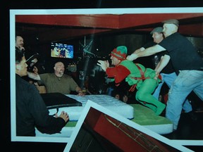 A poster advertising a dwarf toss is pictured in the men's washroom at Leopard's Lounge and Broil, Friday, Jan. 27, 2012. (DAX MELMER/The Windsor Star)