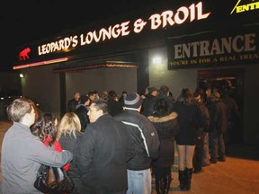 Dozens line up outside of Leopard's Lounge & Broil to attend a dwarf tossing competition Sat., Jan. 28, 2012. This is the second time in a decade Leopards has hosted this type of event. (REBECCA WRIGHT/ The Windsor Star)