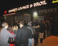 Dozens line up outside of Leopard's Lounge & Broil to attend a dwarf tossing competition Sat., Jan. 28, 2012. This is the second time in a decade Leopards has hosted this type of event. (REBECCA WRIGHT/ The Windsor Star)