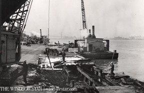 1954-Work of wrecking the old Ferry Company docks between Station st. and Government dock began this week when the Canadian Dredge and Dock Company of Toronto moved in with men and equipment to commence operations of a new retaining wall. (The Windsor Star-FILE)