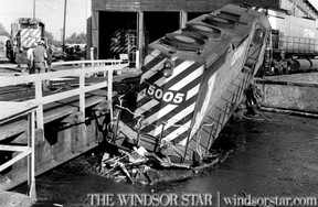 June13 1979- An error in judgement with a 120 ton diesel engine can result in some weighty problems. They had those problems today at a CP Rail locomotive shop near Crawford Ave. (The Windsor Star-FILE)