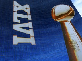Official signage of the Lombardi Trophy and Super Bowl XLVI is seen on the exterior of the J.W. Marriott Indianapolis, which is serving as the Super Bowl Media center, is seen prior to Super Bowl XLVI between the New York Giants and the New England Patriots on February 1, 2012 in Indianapolis, Indiana. (Photo by Scott Halleran/Getty Images)