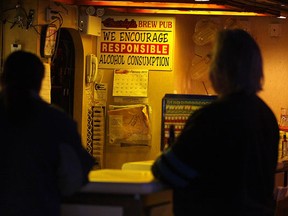 Charly's Brew Pub and Grill in Windsor, Ont. will be closing at the end of April, 2012. The landmark tavern will close its doors after 60 years. A couple of patrons have a beer at the bar Tuesday, Feb. 21, 2012. (DAN JANISSE/The Windsor Star)