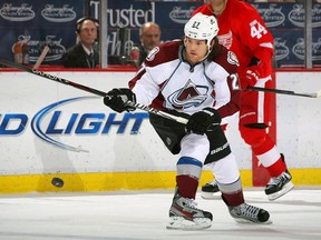 Steve Downie #27 of the Colorado Avalanche plays the puck against the Detroit Red Wings during their NHL game at Joe Louis Arena on February, 2012 in Detroit, Michigan. (Photo by Dave Sandford/Getty Images)