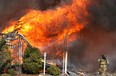 A home in the 1000 block of Esdras Place is engulfed in flames Mar. 24, 2011, in Windsor, Ont. (Photo By: Dan Janisse)